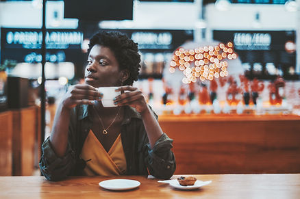 Woman with coffee looking relaxed because VAT is not stressful